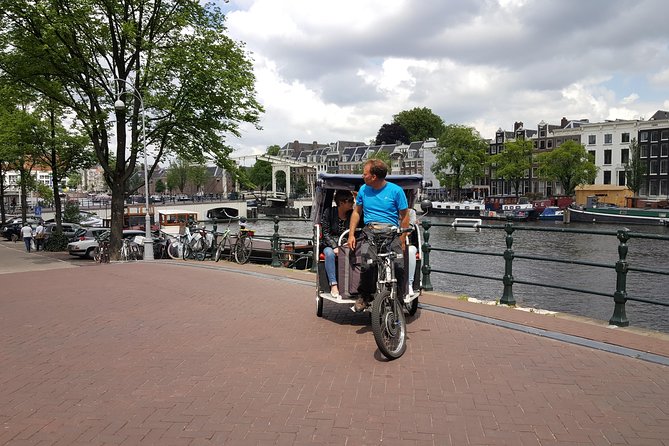 1,5 hours Amsterdam Rickshaw Tour - From Nieuwmarkt to the Waag Gate: How the Tour Starts with Real Amsterdam Texture
