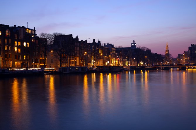 1-Hour Amsterdam Evening Canal Cruise - On-board vibe: friendly captains, quirky guides, and the limits of one hour