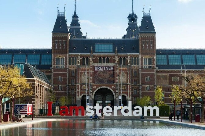 1 Hour Private Amsterdam Rickshaw Tour - Stop at Nieuwmarkt: historic gates and real architecture