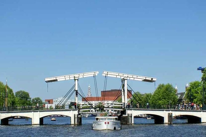 5 hrs Golden Age Amsterdam Private Walking Tour With Local Guide - The political heart at Dam Square, then memory at the National Monument