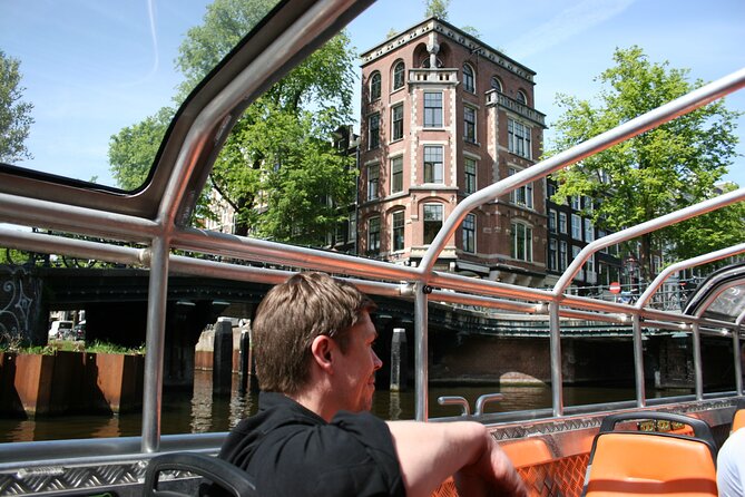 Amsterdam 1h Canal Cruise by Semi-Open Boat with Audio Guide - Semi-Open, Solar-Powered Boat: A Different Angle on the Canal Belt