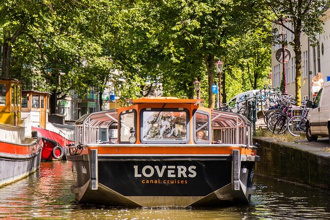 Amsterdam 1h Canal Cruise by Semi-Open Boat with Audio Guide - Red Light District, Anne Frank House, and Other Heavy Stops