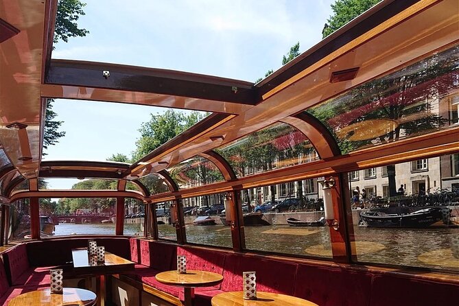 Amsterdam 2 Hour Small-Group Canal Cruise with Dutch Snacks & Bar - Amstel River to Magere Brug: classic angles with romance built in