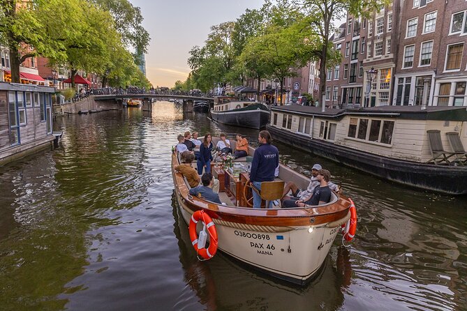 Amsterdam 2 Hour Small-Group Canal Cruise with Dutch Snacks & Bar - Snacks, bar service, and staying warm (yes, even in a boat)