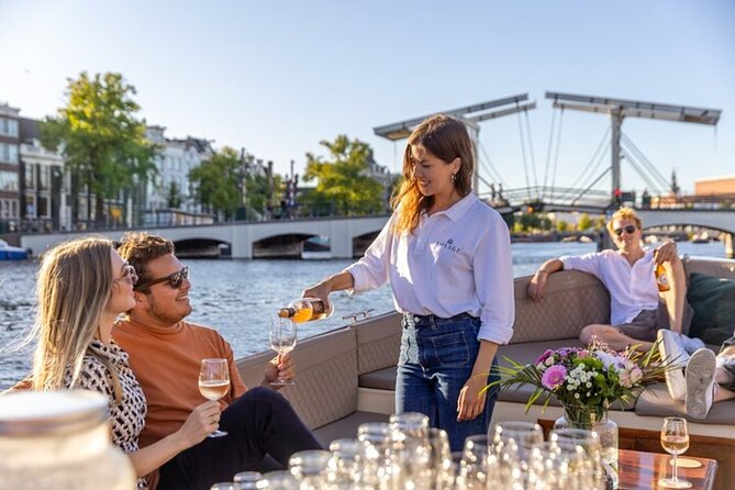 Amsterdam 2 Hour Small-Group Canal Cruise with Dutch Snacks & Bar - Cheese Museum, Anne Frank House, and Westerkerk from the waterline