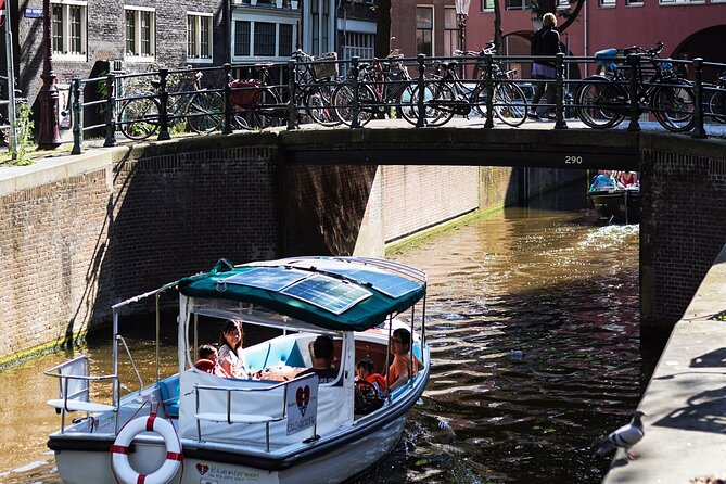 Amsterdam 90-min Private Canal Cruise with Live Guide and Drinks - Live Skipper Energy, Drinks, and Staying Warm in Real Weather