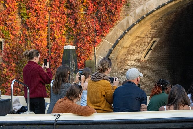 Amsterdam 90 minutes Canal Cruise with bar and snacks on board. - Amstel River highlights: churches, theaters, and the city’s big waterline