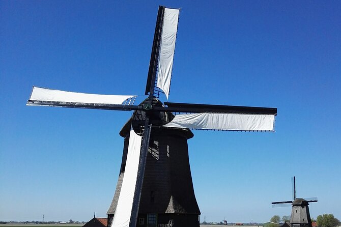 Amsterdam and Countryside Private Full-Day Tour by luxury car - Amsterdam from the car: Dam Square to the Canal Belt