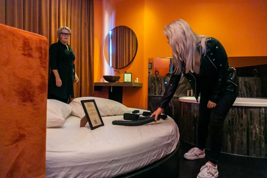 Amsterdam: Brothel Tour with Sex Worker Guide - Walking through BonTon: VIP rooms, bar, and the details that change your perspective