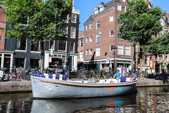 Amsterdam Canal Cruise in Open Boat with Unlimited Drinks Option - Photo moments that actually improve your photos and your sense of place