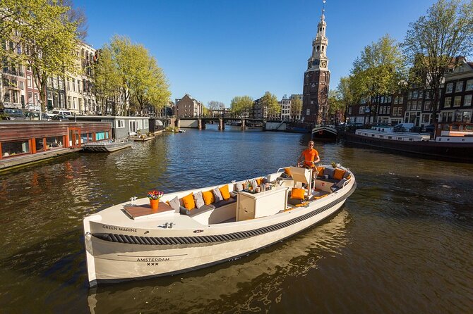 Amsterdam Canal Cruise with German Guide and unlimited drinks - Where you board on Oosterdokskade and what the boat ride feels like