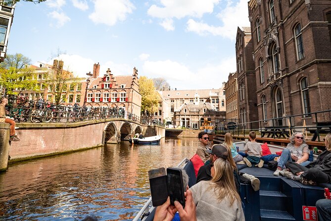 Amsterdam Canal Cruise with Live Guide and Two Drinks - UNESCO Canal Belt: Seeing the Shape of Amsterdam