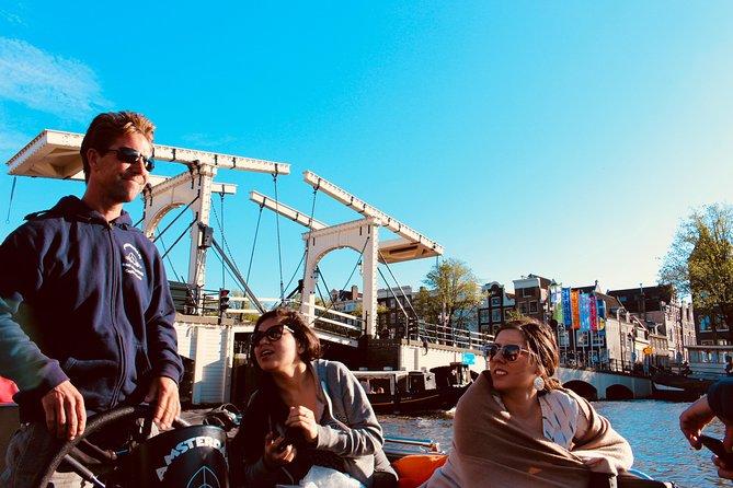 Amsterdam Canal Tour by Open Boat – 90 min Small Group Experience - Amstel River Views: Dancing Houses and Leaning Buildings