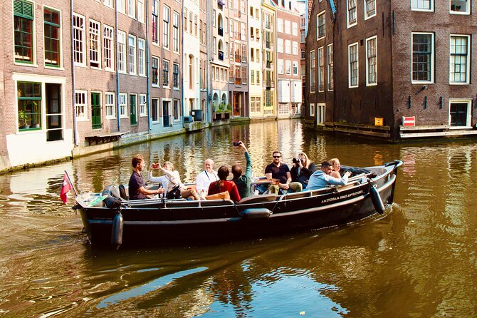 Amsterdam Canal Tour by Open Boat – 90 min Small Group Experience - Munt Tower and the Shift Toward the Old City