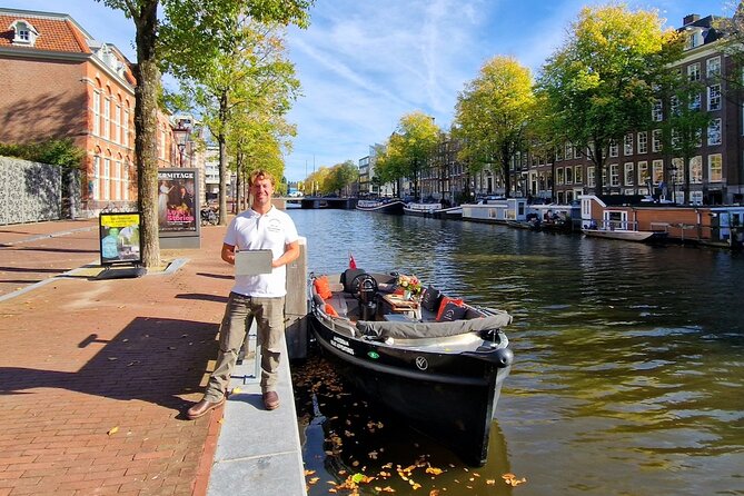 Amsterdam Canal Tour by Open Boat – 90 min Small Group Experience - De Wallen Borders and Oudezijds Voorburgwal: Seeing Without Getting Stuck
