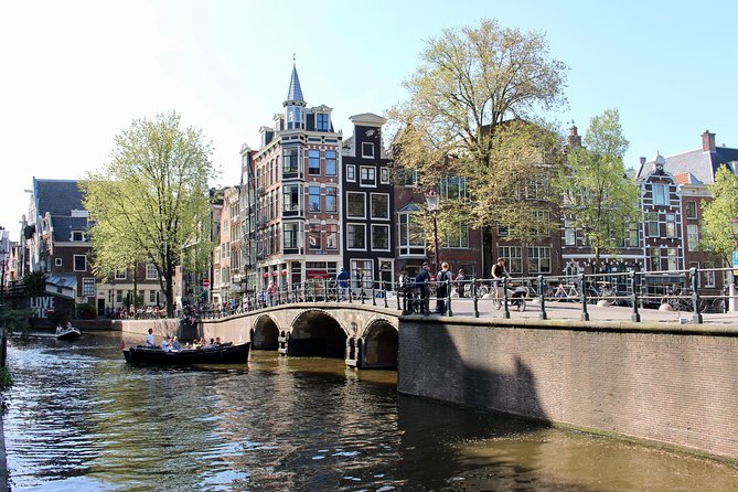 Amsterdam Canal Tour by Open Boat – 90 min Small Group Experience - Nieuwmarkt and de Waag: A Building With Many Lives