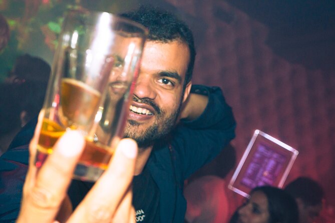 Amsterdam: City Centre Bar Crawl and Nightlife Experience - Free drinks: beer, shots, and the fine print inside bars