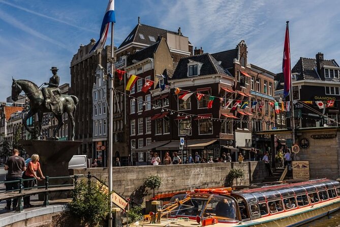 Amsterdam City Highlights and Hidden Gems - Private & Custom Tour - Stop 1: The Historic Canal Belt Through Local Eyes