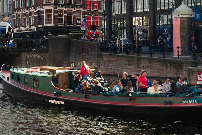 Amsterdam Classic Canal Cruise on a Historic Tugboat - Roman Catholic waterfront views: ornate facade from the water