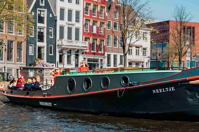 Amsterdam Classic Canal Cruise on a Historic Tugboat - The river segment: classic bridges and elegant canal-side buildings