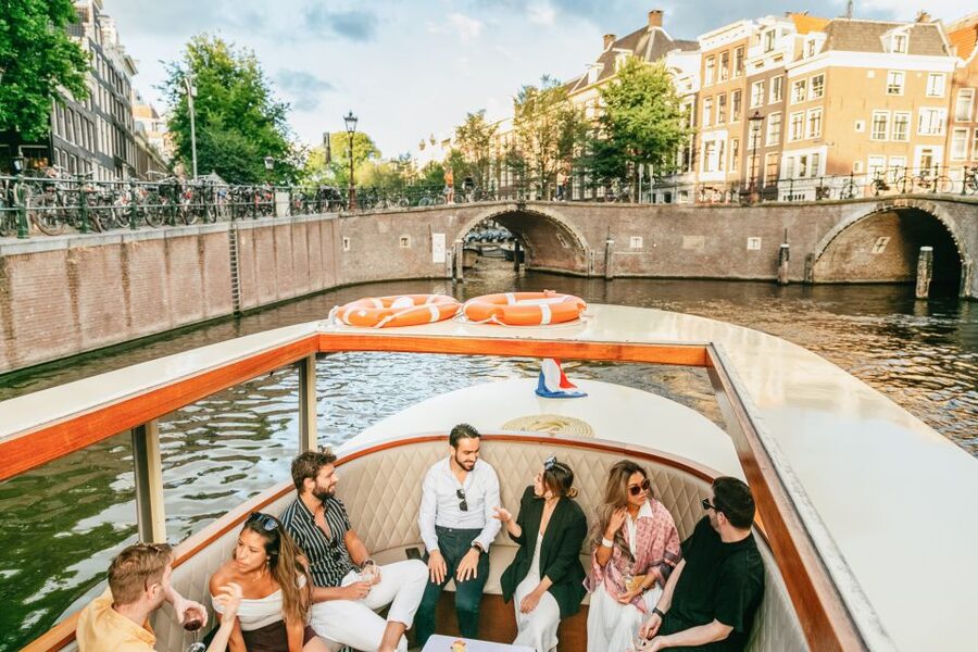 Amsterdam: Classic Saloon Boat Cruise with Cheese & Wine - The hosts and skippers: why the narration feels personal