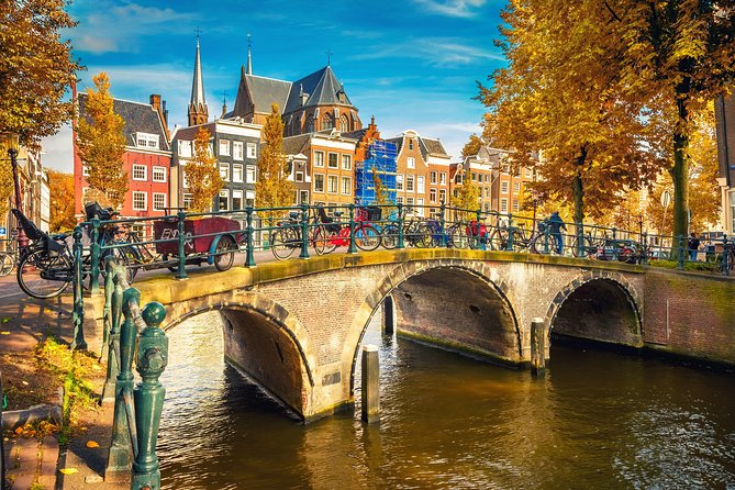 Amsterdam Classic Saloon Boat Cruise with Drinks and Cheese - Covered Wooden Saloon Boat: Staying Warm Without Missing the Canals