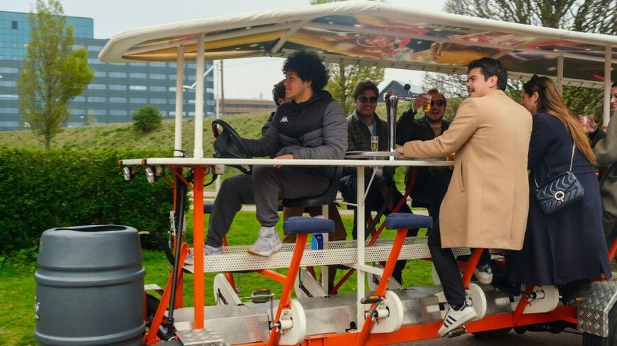 Amsterdam: Dutch Beer Bike Blast Tour with Onboard Bar - The 65-minute Sloterdijk ride: your guide, the tunes, and the steady pace