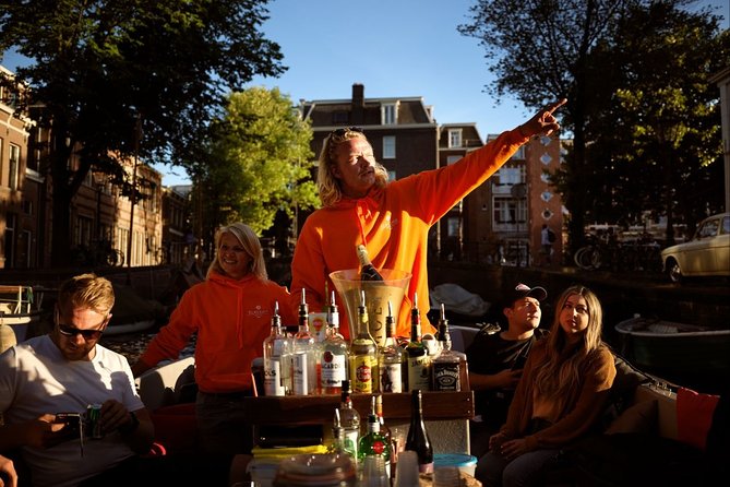 Amsterdam Evening Canal Cruise with Live Guide and Onboard Bar - Magere Brug (Skinny Bridge): The Evening Bridge Moment