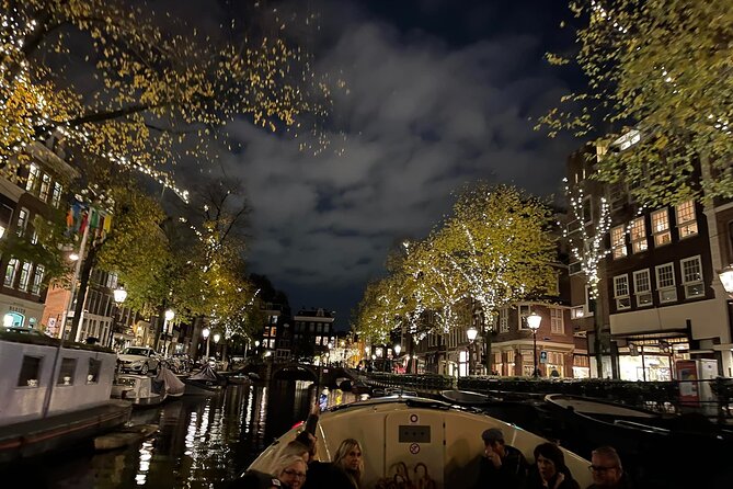 Amsterdam Evening Cosy & Small Cruise & Drinks and Bites - Sunset - The open electric boat at sunset: what the ride feels like