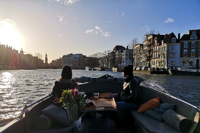 Amsterdam Evening Cruise in Small Group - Stop-by-stop highlights: dancing houses, Zuiderkerk, Munt Tower, and the flower stalls
