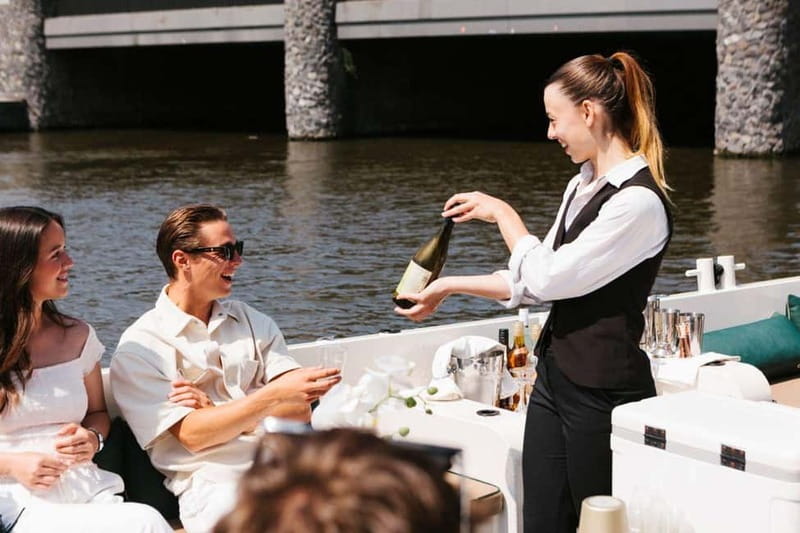 Amsterdam Evening (Sunset) Canal Cruise w/ optional drinks - On Board: Electric Eco Boats, Small-Group Comfort, and No Microphones
