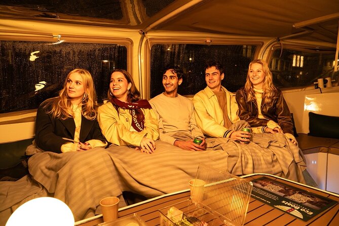 Amsterdam Evening (Sunset) Canal Cruise with optional drinks - The Skinny Bridge moment: wood, legends, and evening lights