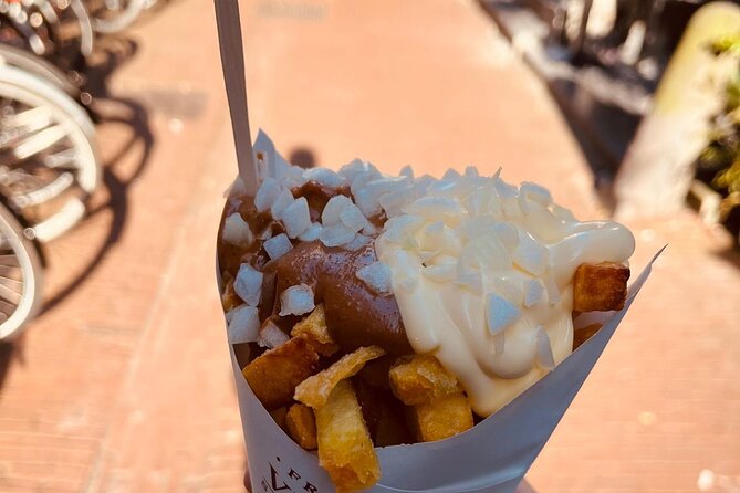 Amsterdam Food Tour with Full Meal & Drinks by Do Eat Better - Munttoren to Bloemenmarkt: minting coins and tasting local cheese