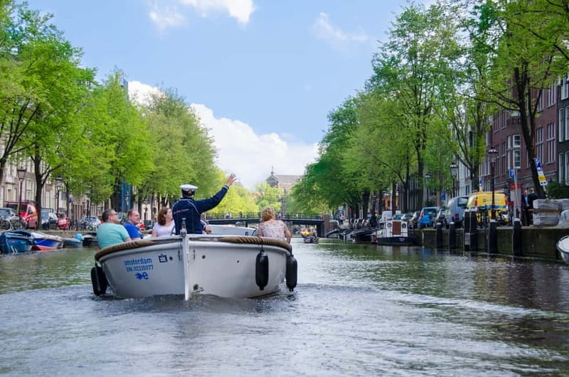 Amsterdam: Guided City Highlights Open Boat Canal Cruise - Live captain commentary: what you’ll get besides scenery