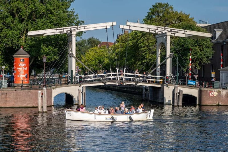 Amsterdam: Guided City Highlights Open Boat Canal Cruise - Small canals, big photo wins, and that relaxed evening feeling