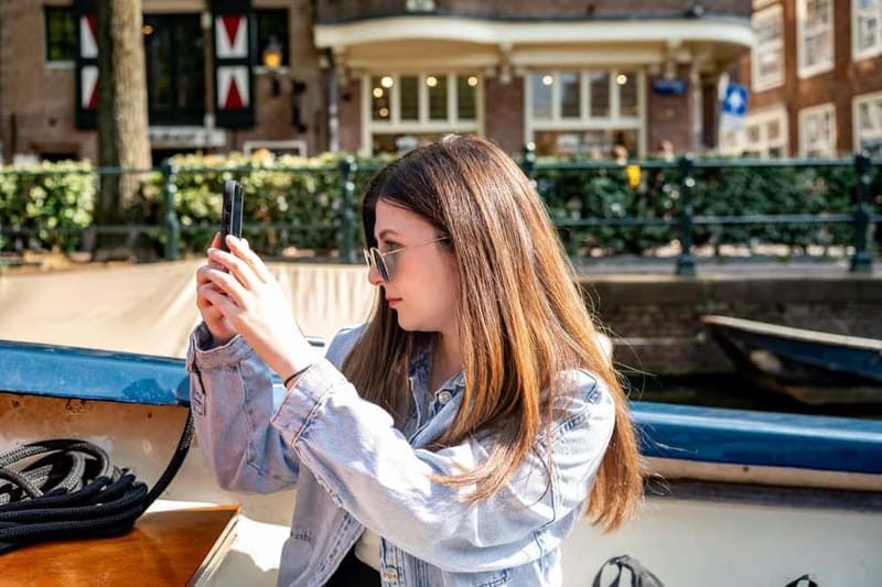Amsterdam: Guided City Highlights Open Boat Canal Cruise - Weather and date limits: how to avoid a ruined plan