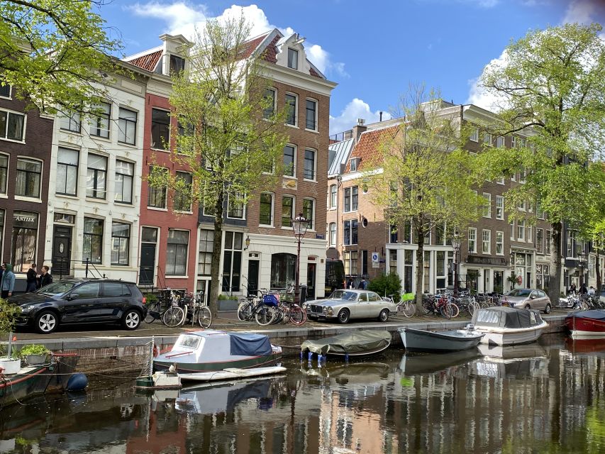 Amsterdam: Guided Off-The-Beaten-Track Walking Tour - Torensluis and the canal-belt lesson: Amsterdam’s engineering, explained on foot
