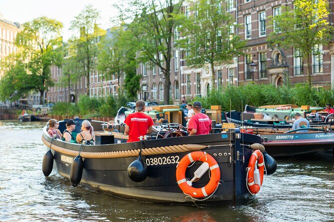 Amsterdam: Guided Open Boat Canal Cruise Unlimited Drinks Option - Rembrandt and the art-and-theater stops that add variety