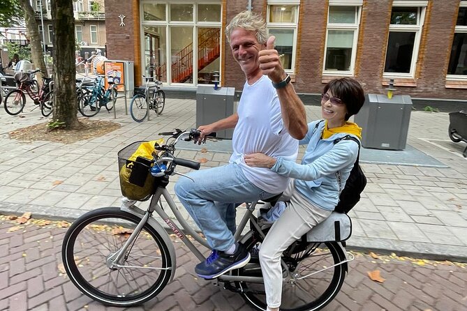 Amsterdam Highlights Bike or E-Bike Tour - Holocaust Namenmonument and Nieuwmarkt: remembrance plus old-city structure