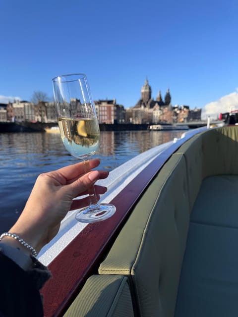 Amsterdam: Historic Boat Cruise with open bar and nibbles - Meet Captain Bow and his crew approach