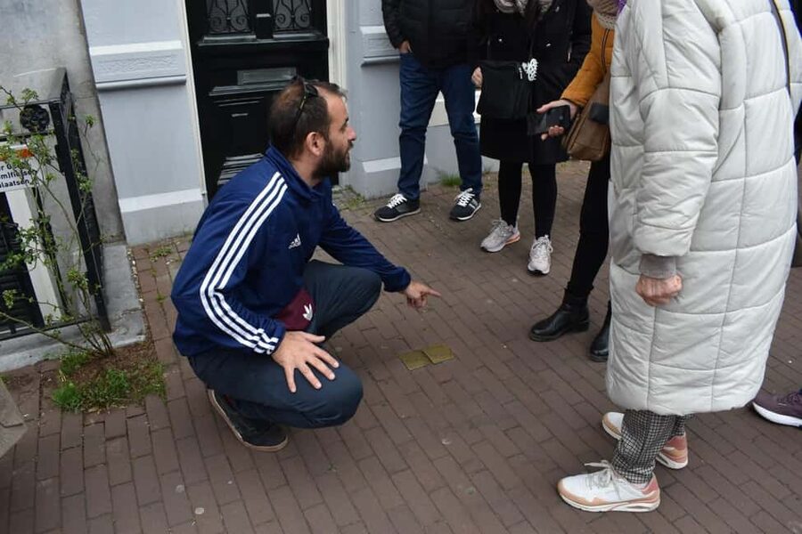 Amsterdam: History, Hidden Gems & Future Eco-Walking Tour - From early settlers to WWII: resilience you can feel in the streets