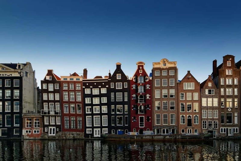 Amsterdam: Iconic Canals & Historic Sights Walking Tour - Dam Square and the Royal Palace: where Amsterdam signals power