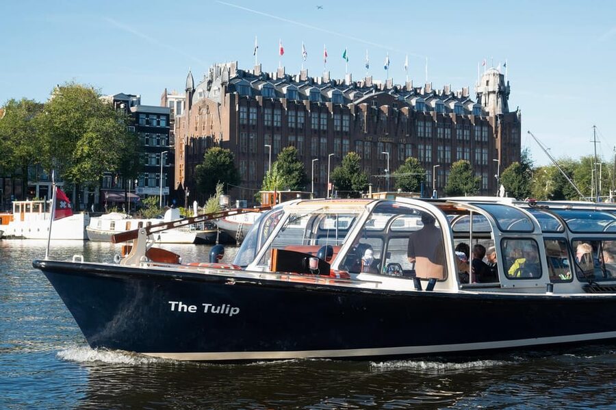 Amsterdam: Keukenhof Ticket with Shuttle Bus + Canal Cruise - The Canal Cruise: Heated Boats, Captain Narration, and Magere Brug