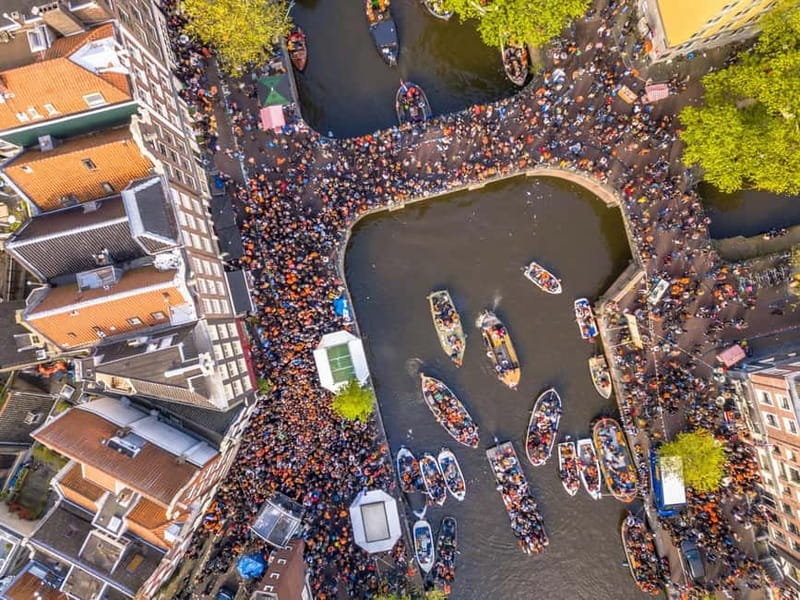 Amsterdam: Kings Day Boat Party with Unlimited Drinks - Getting to the boat: Stationsplein 40, Central Station, and the dark green flag