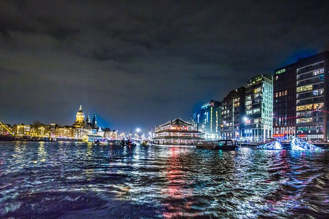 Amsterdam Light Festival: Canal Cruise + Snack & Unlimited Drinks - Covered-boat reality in winter: staying warm and seeing clearly