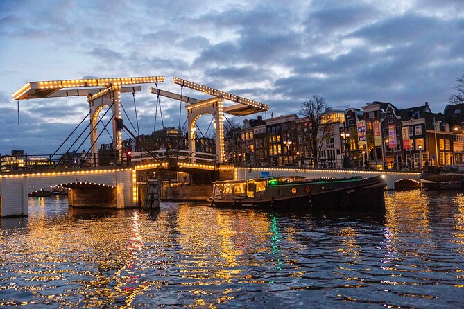 Amsterdam: Light Festival Open Boat - Unl. Drinks Option - Montelbaanstoren, silly Jake, and the city’s clockwork myths
