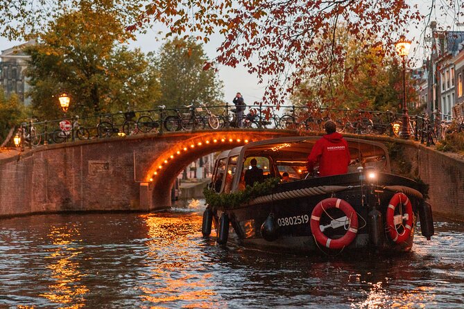 Amsterdam: Light Festival Open Boat - Unl. Drinks Option - An iconic drawbridge and the tales your guide tests
