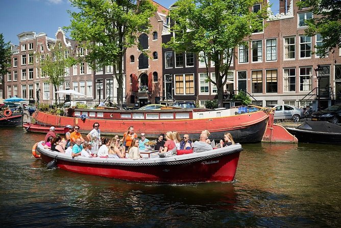 Amsterdam Light Festival: Saloon Boat Cruise + Hot Drinks & Bite - Setting out near the National Maritime Museum area