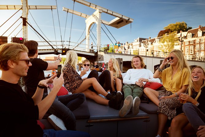 Amsterdam Light Festival: Saloon Boat Cruise + Hot Drinks & Bite - 75 minutes of Light Festival art along the Canal Ring