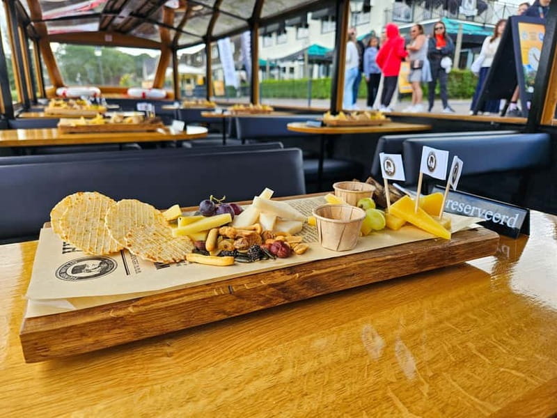 Amsterdam: Live GuideD Giethoorn Boat Tour & Cheese Platter - From Amsterdam to Giethoorn: Coach Time That Actually Helps